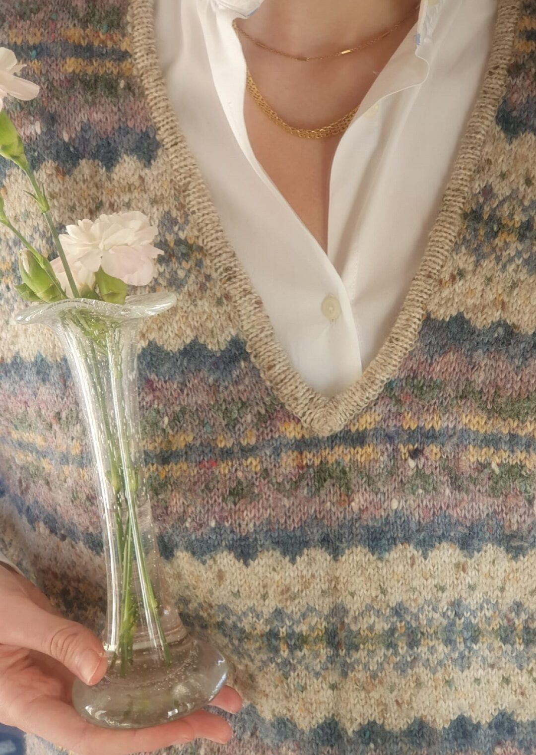 close up of a vintage pastel sleevless jumper